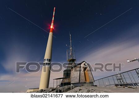 Stock Photo - Meteorological station and radio antenna on the summit of Santis Mountain in full moonlight, Appenzell Outer Rhodes, Switzerland, Europe, PublicGround, Europe. Fotosearch