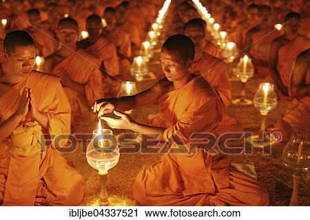 Monk lights candle, meditation, Wat Phra Dhammakaya Temple, Khlong Luang District, Pathum Thani, Bangkok, Thailand, Asia *** IMPORTANT: Image may not be used in a negative context with the Dhammakaya temple *** View Large Photo Image Stock Image - Monk lights candle, meditation, Wat Phra Dhammakaya Temple, Khlong Luang District, Pathum Thani, Bangkok, Thailand, Asia *** IMPORTANT: Image may not be used in a negative context with the Dhammakaya temple ***. Fotosearch