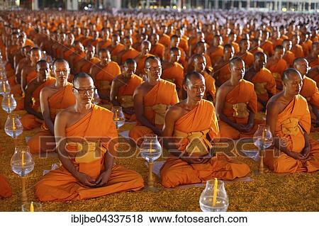 Monks sitting in a row meditating, Wat Phra Dhammakaya Temple, Khlong Luang District, Pathum Thani, Bangkok, Thailand, Asia *** IMPORTANT: The images may be used only in the positive sense of the Dhammakaya temple *** View Large Photo Image Stock Photo - Monks sitting in a row meditating, Wat Phra Dhammakaya Temple, Khlong Luang District, Pathum Thani, Bangkok, Thailand, Asia *** IMPORTANT: The images may be used only in the positive sense of the Dhammakaya temple ***. Fotosearch