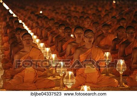 Monks sitting in rows praying and meditating by candlelight, Wat Phra Dhammakaya Temple, Khlong Luang District, Pathum Thani, Bangkok, Thailand, Asia *** IMPORTANT: Image may not be used in a negative context with the Dhammakaya temple *** View Large Photo Image Stock Image - Monks sitting in rows praying and meditating by candlelight, Wat Phra Dhammakaya Temple, Khlong Luang District, Pathum Thani, Bangkok, Thailand, Asia *** IMPORTANT: Image may not be used in a negative context with the Dhammakaya temple ***. Fotosearch