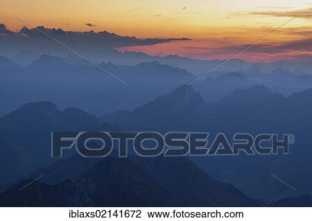 Mountain peaks with different shades seen from the summit of Santis Mountain, after sunset, Appenzell Outer Rhodes, Switzerland, Europe, PublicGround, Europe View Large Photo Image Stock Image - Mountain peaks with different shades seen from the summit of Santis Mountain, after sunset, Appenzell Outer Rhodes, Switzerland, Europe, PublicGround, Europe. Fotosearch