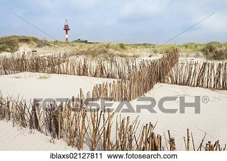 Navigational beacon at Hoernum Odde at a beach with reeds to prevent sand drifting, Hoernum, Sylt, North Frisia, Schleswig-Holstein, Germany, Europe View Large Photo Image Stock Image - Navigational beacon at Hoernum Odde at a beach with reeds to prevent sand drifting, Hoernum, Sylt, North Frisia, Schleswig-Holstein, Germany, Europe. Fotosearch