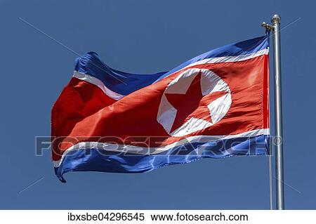 Nord-koreanische Flagge, Nordkorea-Fahne weht im Wind, blauer Himmel View Large Photo Image Stock Photography - Nord-koreanische Flagge, Nordkorea-Fahne weht im Wind, blauer Himmel. Fotosearch