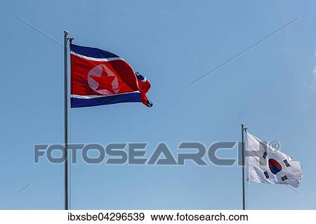 Nord Koreanische Und Sud Koreanische Flaggen Nordkorea Sudkorea Fahnen Wehen Im Wind Blauer Himmel Asien Stock Photo Ibxsbe Fotosearch