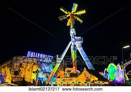 Oktoberfest, Wiesn, amusement rides, giant rotating pendulum at night, ghost train at the rear, Munich, Bavaria, Germany, Europe View Large Photo Image Stock Photo - Oktoberfest, Wiesn, amusement rides, giant rotating pendulum at night, ghost train at the rear, Munich, Bavaria, Germany, Europe. Fotosearch