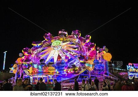 Stock Image - Oktoberfest, Wiesn, Playball, a rotating amusement ride at night, Munich, Bavaria, Germany, Europe. Fotosearch