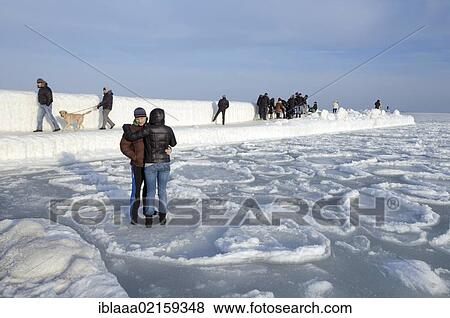Stock Photo - People at icy pier, frozen Black Sea, a rare phenomenon, Odessa, Ukraine, Eastern Europe, Europe. Fotosearch