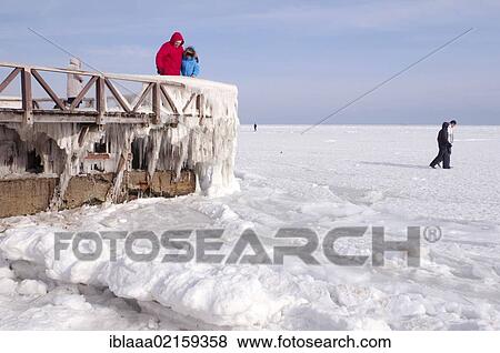 People on icy pier, frozen Black Sea, a rare phenomenon, Odessa, Ukraine, Eastern Europe, Europe View Large Photo Image Stock Photo - People on icy pier, frozen Black Sea, a rare phenomenon, Odessa, Ukraine, Eastern Europe, Europe. Fotosearch