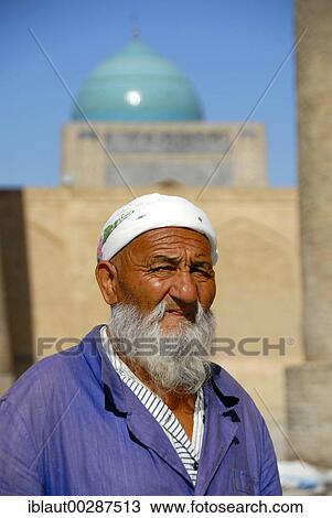 Portrait old Muslim believer with beard in front of blue cupola of Mosque Kalon Bukhara Uzbekistan View Large Photo Image Stock Image - Portrait old Muslim believer with beard in front of blue cupola of Mosque Kalon Bukhara Uzbekistan. Fotosearch