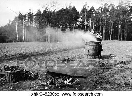 Stock Photography - Potato fire on the field ca. 1930, exact place unknown, Germany, Europe. Fotosearch