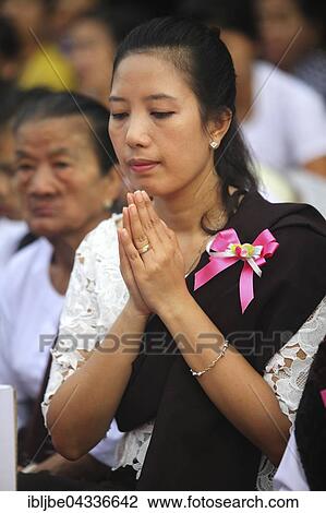 Praying woman at Bigboon pilgrims' procession, day of meditation of the Dhammakaya Foundation, Dawei, Tanintharyi Region, Myanmar, Asia *** IMPORTANT: Image may not be used in a negative context with the Dhammakaya temple *** View Large Photo Image Stock Image - Praying woman at Bigboon pilgrims' procession, day of meditation of the Dhammakaya Foundation, Dawei, Tanintharyi Region, Myanmar, Asia *** IMPORTANT: Image may not be used in a negative context with the Dhammakaya temple ***. Fotosearch