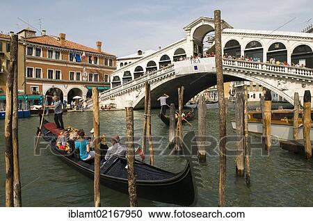 Rialto Bridge with the Grand Canal, Canal Grande, with gondola, Venice, Veneto, Italy, Europe View Large Photo Image Stock Image - Rialto Bridge with the Grand Canal, Canal Grande, with gondola, Venice, Veneto, Italy, Europe. Fotosearch