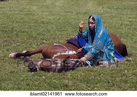 Rider of the Royal Cavalry of Oman at the international horse show, Pferd International Munich, demonstrating the obedience of her horse and traditional Omani Riding, Munich, Bavaria, Germany, Europe View Large Photo Image Stock Image - Rider of the Royal Cavalry of Oman at the international horse show, Pferd International Munich, demonstrating the obedience of her horse and traditional Omani Riding, Munich, Bavaria, Germany, Europe. Fotosearch