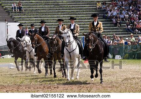 Riders wearing traditional dress demonstrating their skills in a show program at the the Pferd International Muenchen, International Horse Show in Munich, Bavaria, Germany, Europe View Large Photo Image Stock Image - Riders wearing traditional dress demonstrating their skills in a show program at the the Pferd International Muenchen, International Horse Show in Munich, Bavaria, Germany, Europe. Fotosearch