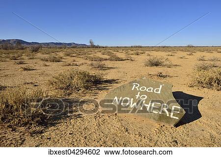Stock Image - Road to Nowhere, Hindweisschild, Namib-Wuste, Namibia, Afrika. Fotosearch