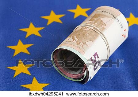 Rolle mit Gummiband, mehrere Geldscheine, Euro-Scheine liegen auf Europa-Fahne View Large Photo Image Stock Image - Rolle mit Gummiband, mehrere Geldscheine, Euro-Scheine liegen auf Europa-Fahne. Fotosearch
