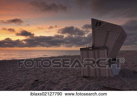 Roofed wicker beach chairs on the beach just after sunset, Hoernum, Sylt island, North Friesland district, Schleswig-Holstein, Germany, Europe View Large Photo Image Stock Image - Roofed wicker beach chairs on the beach just after sunset, Hoernum, Sylt island, North Friesland district, Schleswig-Holstein, Germany, Europe. Fotosearch