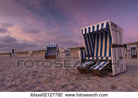 Roofed wicker beach chairs on the beach just after sunset, Hoernum, Sylt island, North Friesland district, Schleswig-Holstein, Germany, Europe View Large Photo Image Stock Image - Roofed wicker beach chairs on the beach just after sunset, Hoernum, Sylt island, North Friesland district, Schleswig-Holstein, Germany, Europe. Fotosearch