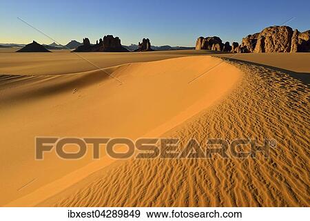 Sanddunen und Felsturme bei Tiou Tatarene, Tassili n'Ajjer Nationalpark, UNESCO Weltnaturerbe, Sahara, Algerien, Afrika View Large Photo Image Stock Photo - Sanddunen und Felsturme bei Tiou Tatarene, Tassili n'Ajjer Nationalpark, UNESCO Weltnaturerbe, Sahara, Algerien, Afrika. Fotosearch