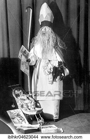 Picture - Santa Claus with doll carriage ca. 1930, exact place unknown, Germany, Europe. Fotosearch