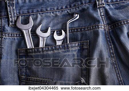 Schraubenschlussel in der Hosentasche einer Jeans View Large Photo Image Stock Photography - Schraubenschlussel in der Hosentasche einer Jeans. Fotosearch