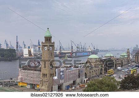 Stock Photograph - St. Pauli Landungsbruecken, Landing Bridges, with the water level tower in St. Pauli, Hamburg, Germany, Europe. Fotosearch