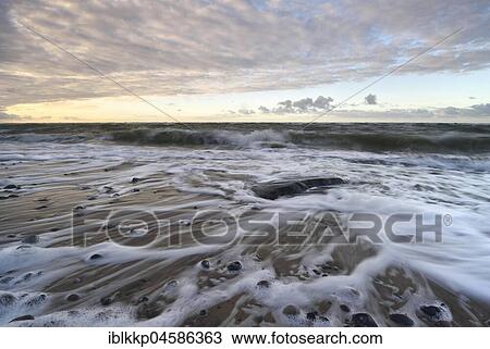 Stock Image - Surf at the Baltic Sea coast near Bakenberg, Rügen, Mecklenburg-Western Pomerania, Germany, Europe. Fotosearch