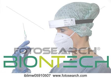 Symbol image Corona vaccine from BIONTECH, woman with syringe, corona crisis, Baden-Württemberg, Germany, Europe View Large Photo Image Stock Photo - Symbol image Corona vaccine from BIONTECH, woman with syringe, corona crisis, Baden-Württemberg, Germany, Europe. Fotosearch