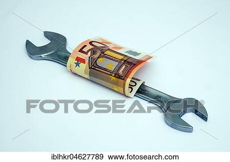 Stock Photo - Symbol picture costs for craftsmen, wrench with euro certificate, Germany, Europe. Fotosearch