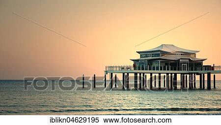 Tea House on the pier at dawn, Timmendorfer Strand, Baltic Sea, Schleswig-Holstein, Germany, Europe View Large Photo Image Stock Photography - Tea House on the pier at dawn, Timmendorfer Strand, Baltic Sea, Schleswig-Holstein, Germany, Europe. Fotosearch