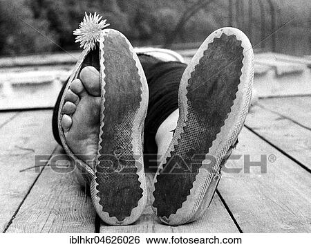 Toes peeking out of broken shoes ca. 1970s, exact place unknown, Czech Republic, Europe View Large Photo Image Stock Photograph - Toes peeking out of broken shoes ca. 1970s, exact place unknown, Czech Republic, Europe. Fotosearch