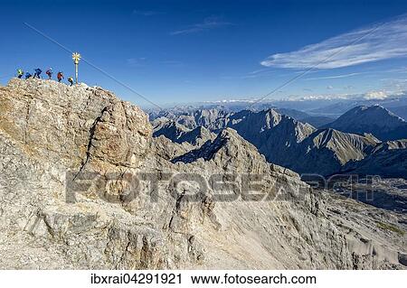 Touristen am Gipfelkreuz der Zugspitze, Ausblick nach Tirol, Garmisch-Partenkirchen, Wettersteingebirge, Alpen, Oberbayern, Bayern, Deutschland, Europa View Large Photo Image Stock Image - Touristen am Gipfelkreuz der Zugspitze, Ausblick nach Tirol, Garmisch-Partenkirchen, Wettersteingebirge, Alpen, Oberbayern, Bayern, Deutschland, Europa. Fotosearch
