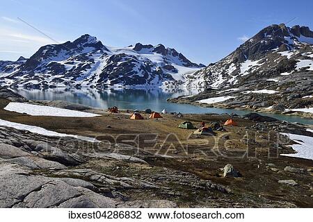 Stock Image - Touristencamp mit Zelten am Sermilik Fjord, Ammassalik Island, Ostgronland, Gronland, Nordamerika. Fotosearch