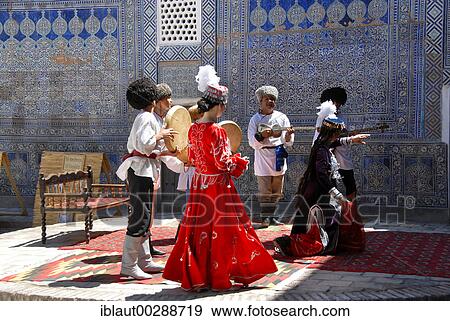 Stock Photo - Traditional dance with clothes of Khwarezm Tash Hauli Palace Khiva Uzbekistan. Fotosearch