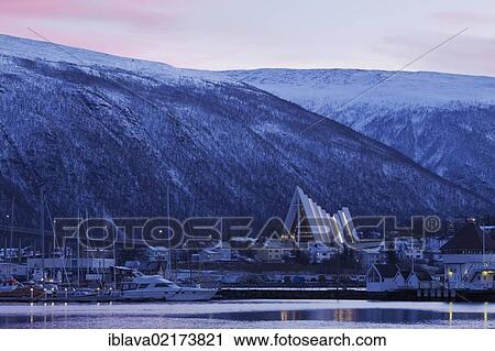 Stock Image - Tromsø, Tromso, with Tromsdalen Church, Arctic Cathedral or Ishavskatredalen, polar night, Norway, Europe. Fotosearch