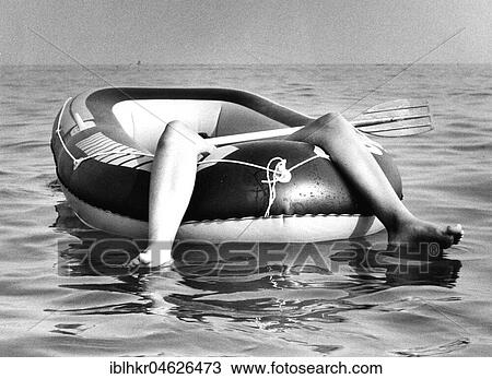 Two legs in rubber dinghy, ca. 1980s, Baltic Sea, GDR, Germany, Europe View Large Photo Image Stock Image - Two legs in rubber dinghy, ca. 1980s, Baltic Sea, GDR, Germany, Europe. Fotosearch