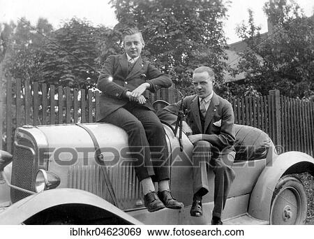 Two young men are proud of their car about 1929, exact place unknown, Germany, Europe View Large Photo Image Stock Photo - Two young men are proud of their car about 1929, exact place unknown, Germany, Europe. Fotosearch