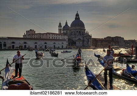 View from St. Mark's Square towards the Chiesa di Santa Maria della Salute Church in the evening light, with returning gondolas on Bacino die San Marco, St. Mark's Basin, at the front, Venice, Veneto, Italy, Europe View Large Photo Image Stock Image - View from St. Mark's Square towards the Chiesa di Santa Maria della Salute Church in the evening light, with returning gondolas on Bacino die San Marco, St. Mark's Basin, at the front, Venice, Veneto, Italy, Europe. Fotosearch