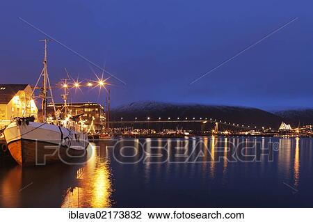 View of the harbour area near to the Tromsø Polarmuseet Polar Museum, with Tromsø bridge lit at back, Tromsø, Tromso, Norway, Europe View Large Photo Image Stock Image - View of the harbour area near to the Tromsø Polarmuseet Polar Museum, with Tromsø bridge lit at back, Tromsø, Tromso, Norway, Europe. Fotosearch