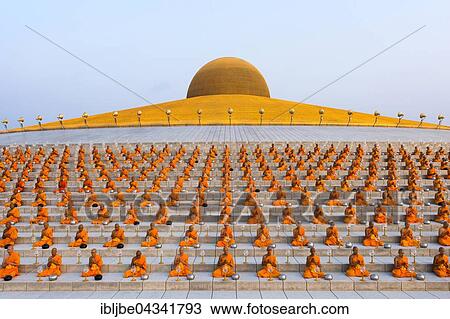 Wat Phra Dhammakaya temple on Makha Bucha Day or Magha Puja Day, Theravada Buddhists, monks sitting around the Chedi Mahadhammakaya Cetiya, Khlong Luang District, Pathum Thani, Bangkok, Thailand, Asia *** IMPORTANT: Image may not be used in a negative... View Large Photo Image Stock Image - Wat Phra Dhammakaya temple on Makha Bucha Day or Magha Puja Day, Theravada Buddhists, monks sitting around the Chedi Mahadhammakaya Cetiya, Khlong Luang District, Pathum Thani, Bangkok, Thailand, Asia *** IMPORTANT: Image may not be used in a negative.... Fotosearch