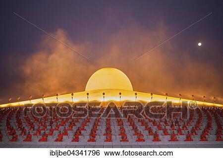Wat Phra Dhammakaya temple on Makha Bucha Day or Magha Puja Day, Theravada Buddhists, monks sitting around the Chedi Mahadhammakaya Cetiya, Khlong Luang District, Pathum Thani, Bangkok, Thailand, Asia *** IMPORTANT: Image may not be used in a negative... View Large Photo Image Stock Photograph - Wat Phra Dhammakaya temple on Makha Bucha Day or Magha Puja Day, Theravada Buddhists, monks sitting around the Chedi Mahadhammakaya Cetiya, Khlong Luang District, Pathum Thani, Bangkok, Thailand, Asia *** IMPORTANT: Image may not be used in a negative.... Fotosearch