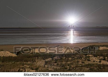 Westerhever Lighthouse at full moon, as seen from St. Peter Ording, North Frisia, Schleswig-Holstein, Germany, Europe View Large Photo Image Stock Photograph - Westerhever Lighthouse at full moon, as seen from St. Peter Ording, North Frisia, Schleswig-Holstein, Germany, Europe. Fotosearch
