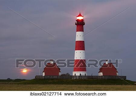 Westerhever lighthouse with the full moon rising above the horizon, Westerheversand, North Friesland district, Schleswig-Holstein, Germany, Europe View Large Photo Image Picture - Westerhever lighthouse with the full moon rising above the horizon, Westerheversand, North Friesland district, Schleswig-Holstein, Germany, Europe. Fotosearch