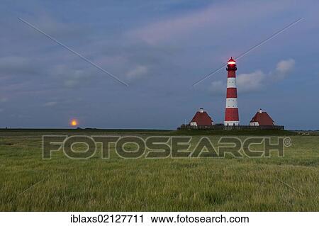 Westerhever lighthouse with the full moon rising above the horizon, Westerheversand, North Friesland district, Schleswig-Holstein, Germany, Europe View Large Photo Image Stock Image - Westerhever lighthouse with the full moon rising above the horizon, Westerheversand, North Friesland district, Schleswig-Holstein, Germany, Europe. Fotosearch