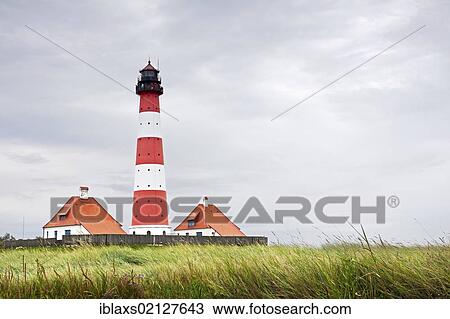 Stock Image - Westerheversand Lighthouse on the Eiderstedt Peninsula, North Frisia, Schleswig-Holstein, Germany, Europe. Fotosearch