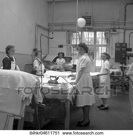 Women folding and ironing textiles, around 1950, Freiburg, Germany, Europe View Large Photo Image Stock Image - Women folding and ironing textiles, around 1950, Freiburg, Germany, Europe. Fotosearch
