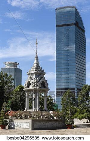 Yeay Penh Monument am Wat Phnom, hinten Canadia Bank und Vattanac Capital Tower, Phnom Penh, Kambodscha, Asien View Large Photo Image Stock Photography - Yeay Penh Monument am Wat Phnom, hinten Canadia Bank und Vattanac Capital Tower, Phnom Penh, Kambodscha, Asien. Fotosearch