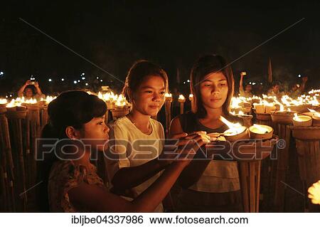 Young women at the lights ceremony, World Peace Festival of the Dhammakaya Foundation, Dawei, Tanintharyi Region, Myanmar, Asia *** IMPORTANT: Image may not be used in a negative context with the Dhammakaya temple *** View Large Photo Image Stock Photograph - Young women at the lights ceremony, World Peace Festival of the Dhammakaya Foundation, Dawei, Tanintharyi Region, Myanmar, Asia *** IMPORTANT: Image may not be used in a negative context with the Dhammakaya temple ***. Fotosearch