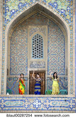 Young women dancing in an arch of Madrasah Tilla-kari Registan Samarkand Uzbekistan View Large Photo Image Picture - Young women dancing in an arch of Madrasah Tilla-kari Registan Samarkand Uzbekistan. Fotosearch