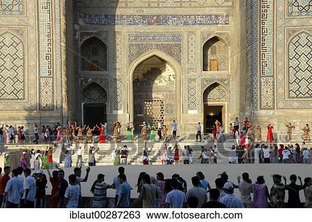 Young women dancing in front of Madrasah Sherdar Registan Samarkand Uzbekistan View Large Photo Image Stock Image - Young women dancing in front of Madrasah Sherdar Registan Samarkand Uzbekistan. Fotosearch
